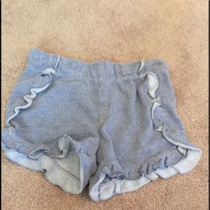 A pair of cat and jack shorts